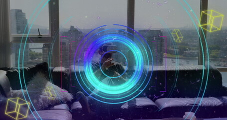 Colorful light trails and scope scanning over caucasian man gesturing while wearing vr headset