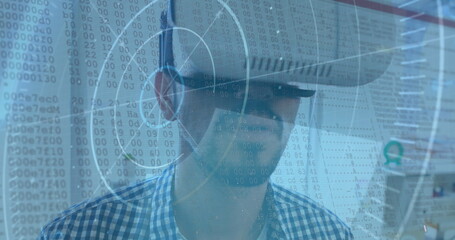 Image of scope scanning and binary coding over man wearing vr headset