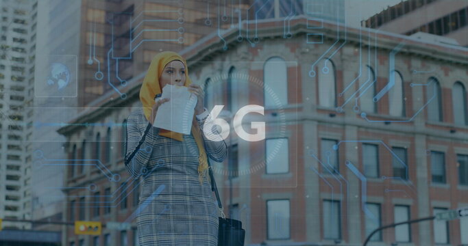 Image of 6g text, scope scanning and data processing over woman in hijab eating sandwich in city - Powered by Adobe