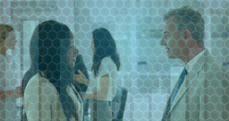 Statistical data processing against diverse businessman and businesswoman shaking hands