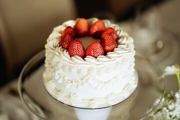 White Cake with Strawberries on Glass Stand