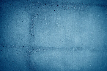 surface with a dark blue color featuring a rough, uneven texture