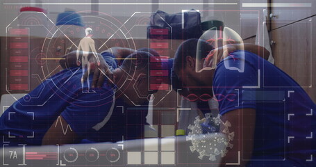 Digital interface with data processing against team of male soccer players making a huddle