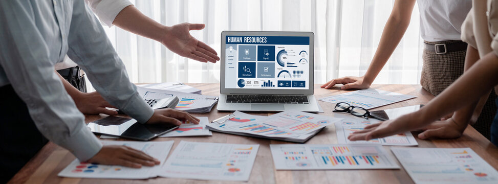 Human resources management software on computer screen helping human resources employee to manage recruitment, payroll, staff searching and KPI evaluation brisk - Powered by Adobe