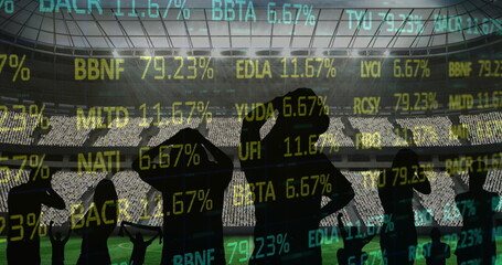 Stock market data processing against silhouette of fans cheering and sports stadium in background