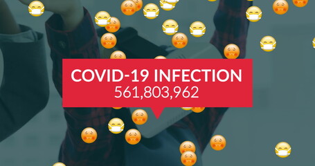 Image of covid 19 data processing over sick emojis with face masks over woman with vr headset