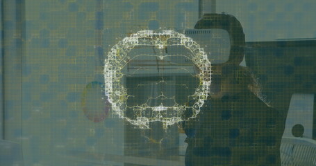 Image of human brain and medical data processing over businesswoman wearing vr headset