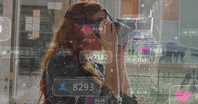 Image of social media icons over globe and woman using vr headset