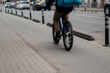 Fototapeta premium A dedicated bicycle lane with a clear road marking and directional arrow, emphasizing urban cycling infrastructure and sustainable transportation