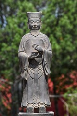 Statue of traditional Chinese scholar at Temple of Heaven in Beijing, China