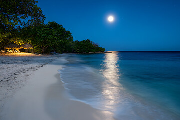 The beach is a peaceful place, where golden sand stretches to the horizon, and the waves gently touch the shore. The sun shines in the sky, and a fresh breeze carries the scent of salt.


