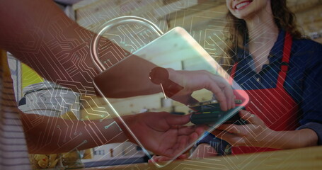 Image of network security padlock over people using payment terminal