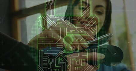 Image of network security padlock over people using payment terminal