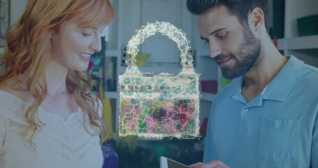 Image of network security padlock over people using payment terminal