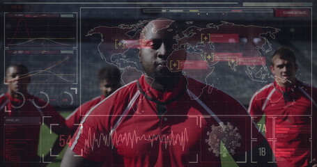 Soccer players in red jerseys standing on field with digital data overlay