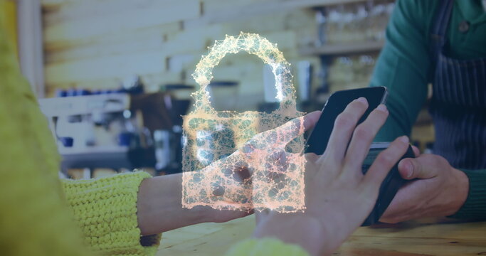 Image of network security padlock over people using payment terminal - Powered by Adobe