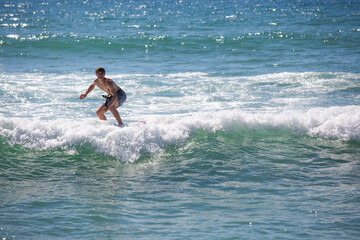 Surfer on low waves