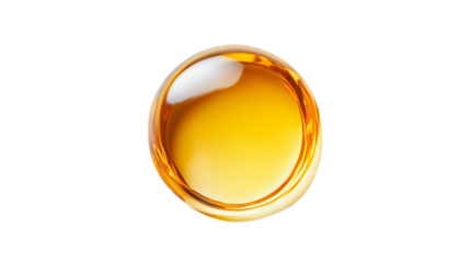 Circular droplet of yellow oily liquid on white background