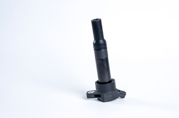 Car ignition coil on white background. Element of car engine.