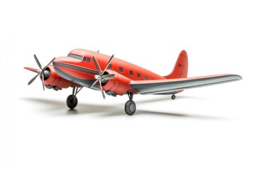 A red and gray vintage airplane model with propellers on a white background in a studio setting