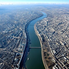 Obraz premium Breathtaking aerial shot; River Thames snakes through London's dense urban core, numerous bridges visible - dense city dramatic panoramic snaking