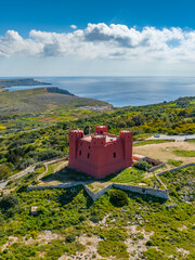 Drone aerial view of Red tower on Malta island, Mellieha city