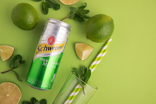 Lviv, Ukraine - April 6, 2025: Iron can of drink Schweppes taste of Classic Mojito with ingredients for cocktail. Top view