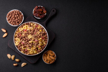 Flakes, chocolate balls and dried fruit for a hearty breakfast