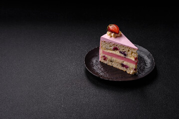 A slice of pink colored puff cake for a birthday celebration