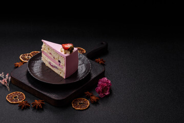 A slice of pink colored puff cake for a birthday celebration