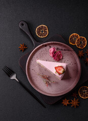 A slice of pink colored puff cake for a birthday celebration