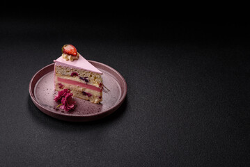 A slice of pink colored puff cake for a birthday celebration