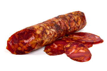 Chorizo sausage, thin cut. Spanish salami, close-up, isolated on white background.