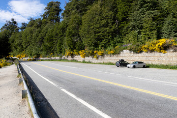 Two cars parked on a stretch of the scenic route on route 40