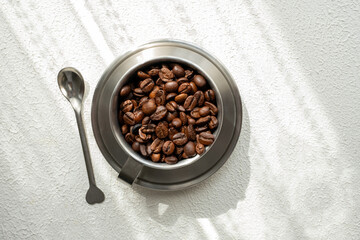 coffee beans in a metal cup close up