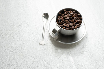 coffee beans in a metal cup close up