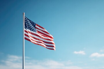 american flag gently waves in clear blue sky with ample copy space invoking themes of remembrance and honor surrounding