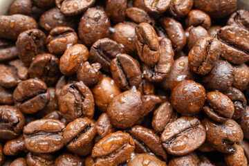 moistened local cultural coffee beans on a rotating background in close-up