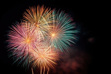 capture explosive display of colorful fireworks bursting against dark night sky illuminating with vibrant hues and