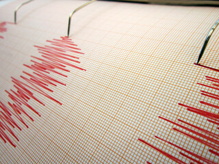 Seismograph and earthquake. A seismograph that records the seismic activity of an earthquake.