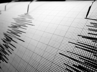 Seismograph and earthquake. A seismograph that records the seismic activity of an earthquake.