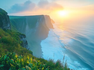 Majestic cliffs overlook the ocean as the sun casts a warm glow