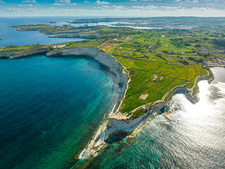 Drone view of south part of Malta island. Green hills, fields, rocks and white cliffs