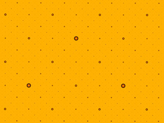 Brown candies on an orange background, abstract digital background