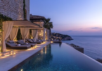 Fototapeta premium Elegant infinity pool area with breathtaking ocean views and charming evening lights : Generative AI