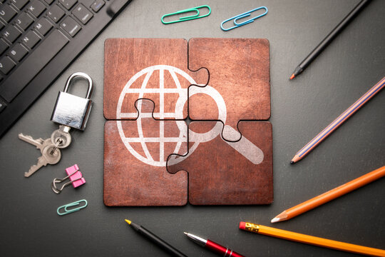 Search and Artificial Intelligence concept. Wooden puzzle pieces with text on a dark office table