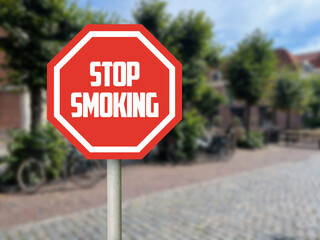 Stop Smoking sign on city street. Space for text