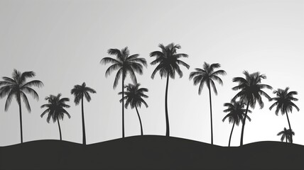 Obraz premium Silhouetted palm trees against a light background at sunset