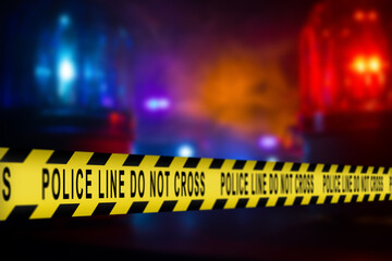 Crime or accident scene sign do not pass the line with police cars in the background