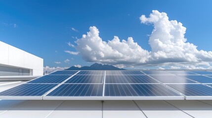 Obraz premium Solar panels on a building roof under a partly cloudy sky